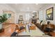 Bright living room with a fireplace, hardwood floors, and an open layout at 211 W Trinity Ave, Durham, NC 27701