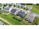 Aerial view of a home with a fenced-in yard and patio set, nestled in a vibrant residential neighborhood at 2123 Scarlet Sage Dr, Durham, NC 27704
