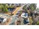 Aerial view showcasing community pool, pond, winding streets, and manicured landscaping at 2123 Scarlet Sage Dr, Durham, NC 27704
