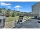 Relaxing backyard features a brick patio, well-maintained lawn, and privacy fencing at 2123 Scarlet Sage Dr, Durham, NC 27704