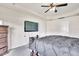 View of a well-appointed bedroom with a flat-screen television mounted on the wall and comfortable furnishings at 2123 Scarlet Sage Dr, Durham, NC 27704