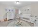 Charming Bedroom with a white crib, dresser, and accent chair at 2123 Scarlet Sage Dr, Durham, NC 27704