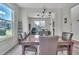 Open-concept dining room with a glass-top table and views into the living space, enhancing the home's flow at 2123 Scarlet Sage Dr, Durham, NC 27704