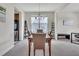 Bright dining room featuring a chandelier, large window, and seating for six, ideal for Gathering meals at 2123 Scarlet Sage Dr, Durham, NC 27704