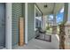 Cozy front porch with a chair and decor, perfect for relaxing and enjoying the neighborhood views at 2123 Scarlet Sage Dr, Durham, NC 27704