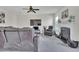 Inviting living room with a fireplace, plush seating, and large screen television at 2123 Scarlet Sage Dr, Durham, NC 27704