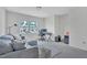 Cozy living room featuring a comfortable sofa, a large window, and a workspace at 2123 Scarlet Sage Dr, Durham, NC 27704