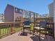 Outdoor deck with two chairs and a view of the neighboring townhouses at 215 Brier Summit Pl, Durham, NC 27703