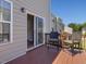 Outdoor deck with two chairs and view to the interior of the townhouse at 215 Brier Summit Pl, Durham, NC 27703