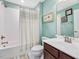 Charming bathroom with a shower/tub combo, classic fixtures, and framed wall decor at 215 Brier Summit Pl, Durham, NC 27703