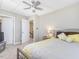 Comfortable bedroom with natural light, ceiling fan, and neutral color palette at 215 Brier Summit Pl, Durham, NC 27703