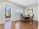 Charming dining area with hardwood floors and views to deck area and back yards at 215 Brier Summit Pl, Durham, NC 27703