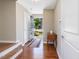 Warm foyer with hardwood floors, open door with a view, and adjacent walls at 215 Brier Summit Pl, Durham, NC 27703