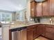 Granite countertops accent the wooden cabinets and stainless steel appliances at 215 Brier Summit Pl, Durham, NC 27703