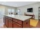 Kitchen island boasting granite countertops and wood cabinets at 215 Brier Summit Pl, Durham, NC 27703
