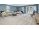 Spacious living area featuring a comfortable sectional sofa, and large windows at 215 Brier Summit Pl, Durham, NC 27703