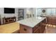 An open living space boasting hardwood floors and ample seating at 215 Brier Summit Pl, Durham, NC 27703