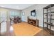 Hardwood floors accent this living space with dining area and media center at 215 Brier Summit Pl, Durham, NC 27703