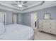 Comfortable main bedroom features neutral walls, carpet, and tray ceiling at 215 Brier Summit Pl, Durham, NC 27703