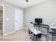 Bright home office with space for computer, desk, and white swivel chair at 215 Brier Summit Pl, Durham, NC 27703