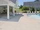 Community pool featuring a covered patio with seating and lounge chairs at 215 Brier Summit Pl, Durham, NC 27703