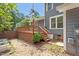 This backyard includes a spacious deck, nice landscaping, and a privacy fence at 2208 Pathway Dr, Chapel Hill, NC 27516