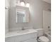 Bathroom with white cabinets and countertop, with shower/bath combo at 2208 Pathway Dr, Chapel Hill, NC 27516