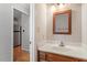 Bathroom with white countertop vanity, and a glimpse of stainless steel appliances at 2208 Pathway Dr, Chapel Hill, NC 27516