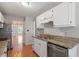 Kitchen with granite countertops, stainless steel appliances, and white cabinets providing storage at 2208 Pathway Dr, Chapel Hill, NC 27516