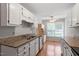Bright kitchen with granite countertops, stainless steel appliances, and lots of natural light at 2208 Pathway Dr, Chapel Hill, NC 27516