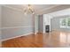 Spacious living room boasts hardwood floors and a cozy fireplace at 2208 Pathway Dr, Chapel Hill, NC 27516