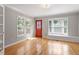 Living room with hardwood floors, bay window, and bright natural light at 2208 Pathway Dr, Chapel Hill, NC 27516