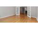 View of living room with hardwood floors, French doors and fireplace at 2208 Pathway Dr, Chapel Hill, NC 27516