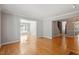 Open-concept living room features hardwood floors and seamless flow to other rooms at 2208 Pathway Dr, Chapel Hill, NC 27516