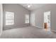 Spacious main bedroom features vaulted ceilings, plush carpeting, and ensuite bathroom at 2208 Pathway Dr, Chapel Hill, NC 27516