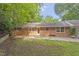 Charming brick home featuring a back patio perfect for outdoor living at 2406 Oxford Rd, Raleigh, NC 27608