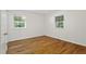 Bedroom featuring lots of light from dual windows and hardwood floors at 2406 Oxford Rd, Raleigh, NC 27608