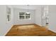 Dining room featuring hardwood floors, neutral paint, and large windows for great natural light at 2406 Oxford Rd, Raleigh, NC 27608