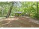 Scenic gazebo in a wooded area for relaxation, a picnic table, and a BBQ grill nearby at 2406 Oxford Rd, Raleigh, NC 27608