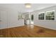 Open-concept living room featuring hardwood floors and a view into the kitchen at 2406 Oxford Rd, Raleigh, NC 27608