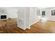 Open floor plan featuring hardwood floors, a fireplace, and seamless flow between the living room and kitchen at 2406 Oxford Rd, Raleigh, NC 27608