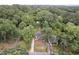 An aerial view of a property and the surrounding neighborhood with mature trees at 2410 Huron St, Durham, NC 27707