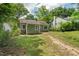 Exterior of home with a small patio and cozy seating area in the backyard at 2410 Huron St, Durham, NC 27707