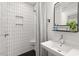 Stylish bathroom featuring subway tile, a modern sink, and sleek black accents at 2410 Huron St, Durham, NC 27707