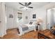 Charming bedroom features wood floors, a ceiling fan, and neutral walls and decor at 2410 Huron St, Durham, NC 27707
