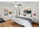 Spacious bedroom featuring hardwood floors, natural light, and a queen-sized bed at 2410 Huron St, Durham, NC 27707