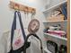 Walk-in closet with a wooden horseshoe rack, shelves, and storage at 2410 Huron St, Durham, NC 27707