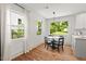 Bright dining room featuring hardwood floors and natural light at 2410 Huron St, Durham, NC 27707