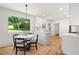 Open-concept kitchen and dining area featuring a quartz countertop at 2410 Huron St, Durham, NC 27707