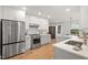 Contemporary kitchen with white cabinets, stainless steel appliances, and a hardwood floors at 2410 Huron St, Durham, NC 27707